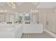 Bathroom featuring a large vanity with dual sinks, tiled floor, and glass shower at 1715 Branchwood Ct, Powder Springs, GA 30127