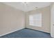 Cozy bedroom with a large window and neutral wall color at 1715 Branchwood Ct, Powder Springs, GA 30127