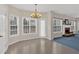 Cozy breakfast nook illuminated by natural light, complemented by a modern chandelier at 1715 Branchwood Ct, Powder Springs, GA 30127