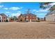 Elegant two-story red brick home boasting symmetrical design, well-manicured landscaping, and a spacious front yard at 1715 Branchwood Ct, Powder Springs, GA 30127