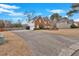 View of the home showcasing an expansive driveway and partial backyard at 1715 Branchwood Ct, Powder Springs, GA 30127