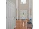 Welcoming foyer with hardwood floors and natural light from the front door at 1715 Branchwood Ct, Powder Springs, GA 30127