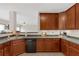 The kitchen features wooden cabinets and a black dishwasher at 1715 Branchwood Ct, Powder Springs, GA 30127