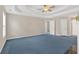 Large main bedroom with ample space, neutral walls, and blue carpeting at 1715 Branchwood Ct, Powder Springs, GA 30127