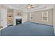 Spacious main bedroom with fireplace, tray ceiling, and two bright windows at 1715 Branchwood Ct, Powder Springs, GA 30127