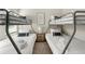 Cozy bedroom featuring two sets of bunk beds and a wooden nightstand with drawers at 1947 Thomasville Estate Dr, Atlanta, GA 30315