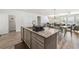 Stylish kitchen island with granite countertop, seating for four, and ample storage space below at 1947 Thomasville Estate Dr, Atlanta, GA 30315