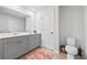 Bathroom featuring double sink vanity and toilet at 6928 Zaniah Rd, Atlanta, GA 30331