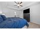 Cozy bedroom with television on a dresser and blue comforter at 6928 Zaniah Rd, Atlanta, GA 30331