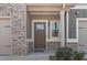 Close up of the front door with brickwork and a window to the side at 6928 Zaniah Rd, Atlanta, GA 30331