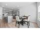 Eat in kitchen with stainless appliances, gray cabinets, and a round table with chairs at 6928 Zaniah Rd, Atlanta, GA 30331