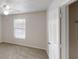 Bright bedroom featuring neutral carpet, natural light from the window, and a white door at 1345 Smoke Hill Dr, Hoschton, GA 30548