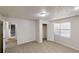 Carpeted bedroom with natural light, closet and doorway to another space offer flexibility at 1345 Smoke Hill Dr, Hoschton, GA 30548