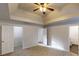 Large bedroom featuring neutral carpet and closet with white wire shelves at 1345 Smoke Hill Dr, Hoschton, GA 30548