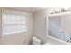 Bright bathroom featuring a window, large mirror, and modern vanity lighting at 2134 Elinwood Dr, Atlanta, GA 30344