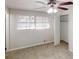 The bedroom offers neutral carpet and light walls, as well as a ceiling fan at 2134 Elinwood Dr, Atlanta, GA 30344