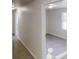 Hallway leading to a room with a large window and carpet flooring at 2134 Elinwood Dr, Atlanta, GA 30344