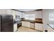 Bright kitchen boasts stainless steel appliances, white cabinets, and granite countertops at 2134 Elinwood Dr, Atlanta, GA 30344