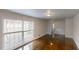 Bright living room features hardwood floors and ample light and staircase view at 2134 Elinwood Dr, Atlanta, GA 30344