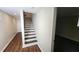 Finished basement stairway featuring wood trim and new flooring at 2232 Addison Nw Pl, Atlanta, GA 30318