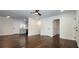 Spacious living room featuring hardwood floors, fresh white paint, and a ceiling fan at 2232 Addison Nw Pl, Atlanta, GA 30318