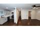 Bright living room with dark hardwood floors, white trim, and an open concept kitchen at 2232 Addison Nw Pl, Atlanta, GA 30318