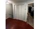 Hallway with wood floors and a closet leading to a bedroom with a bed at 3523 Lehigh Way, Decatur, GA 30034