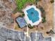 Aerial view of the neighborhood pool and cabana with parking in a wooded area at 5712 Overlook Cir, Powder Springs, GA 30127