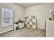 Simple bedroom with carpet, single window, and minimal furnishings at 5712 Overlook Cir, Powder Springs, GA 30127