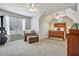 Spacious bedroom featuring chair, bed, natural light, and neutral paint at 5712 Overlook Cir, Powder Springs, GA 30127