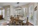 Breakfast nook with bright lighting, a modern chandelier and an adjacent outdoor deck or patio at 5712 Overlook Cir, Powder Springs, GA 30127