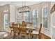 Cozy breakfast nook with a modern chandelier, offering views through large windows at 5712 Overlook Cir, Powder Springs, GA 30127