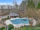 A community pool covered for the off season with adjacent cabana in a landscaped setting at 5712 Overlook Cir, Powder Springs, GA 30127