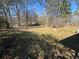 Expansive backyard with mature trees and potential for landscaping at 614 Hunnicutt Se Rd, Mableton, GA 30126