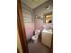 Bathroom featuring pink tiling and a single vanity at 614 Hunnicutt Se Rd, Mableton, GA 30126