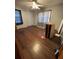 Modest bedroom featuring hardwood floors and a ceiling fan, ready for renovation at 614 Hunnicutt Se Rd, Mableton, GA 30126