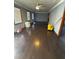 Living room featuring hardwood floors, abundant natural light, and ample space at 614 Hunnicutt Se Rd, Mableton, GA 30126