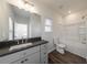 Bathroom featuring modern vanity, a toilet, and a shower/tub combo at 7477 Caribou Trl, Riverdale, GA 30296