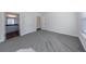 Spacious bedroom featuring neutral carpet and an en-suite bathroom at 7477 Caribou Trl, Riverdale, GA 30296