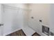 Small laundry room featuring a wire shelf and flooring with a faux wood grain at 7477 Caribou Trl, Riverdale, GA 30296