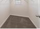 Empty walk-in closet with carpet and wire shelving at 7477 Caribou Trl, Riverdale, GA 30296