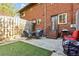 Charming backyard featuring an outdoor seating area, perfect for relaxing or entertaining guests with a grill at 1600 Briarcliff Ne Rd # 5, Atlanta, GA 30306