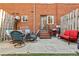 Cozy backyard patio area with outdoor seating, ideal for gatherings, featuring steps up to the home at 1600 Briarcliff Ne Rd # 5, Atlanta, GA 30306
