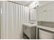 Bathroom with white shower curtain, gray vanity and cabinet for storage at 1600 Briarcliff Ne Rd # 5, Atlanta, GA 30306