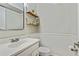 Powder room featuring a vanity, toilet, and decorative shelves for added charm at 1600 Briarcliff Ne Rd # 5, Atlanta, GA 30306