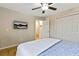 Bedroom with hardwood floors, ceiling fan, mounted TV and closet doors at 1600 Briarcliff Ne Rd # 5, Atlanta, GA 30306