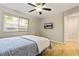 Bedroom with hardwood floors, a window with blinds, and mounted TV at 1600 Briarcliff Ne Rd # 5, Atlanta, GA 30306