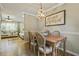Open-concept dining area with hardwood floors and seamless access to the living room at 1600 Briarcliff Ne Rd # 5, Atlanta, GA 30306