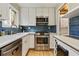 Modern kitchen with stainless steel appliances, white cabinets, and blue subway tile backsplash at 1600 Briarcliff Ne Rd # 5, Atlanta, GA 30306