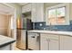 Well-lit kitchen featuring stainless steel appliances, white cabinets, and ample countertop space at 1600 Briarcliff Ne Rd # 5, Atlanta, GA 30306